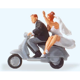 Married couple on vespa